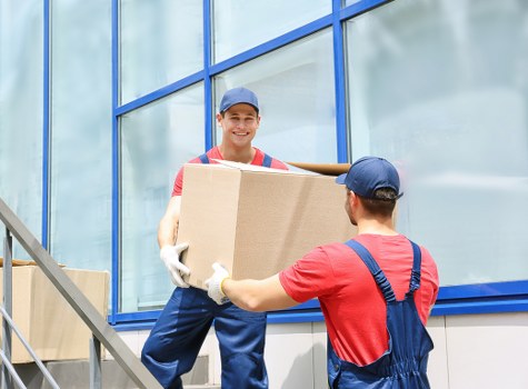 Local moving truck helping with furniture transport in West Hampstead