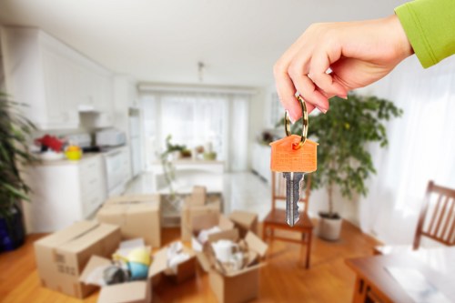 Professional movers discussing a relocation plan in West Hampstead
