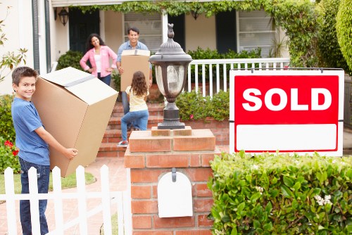 Removal service loading household items with care