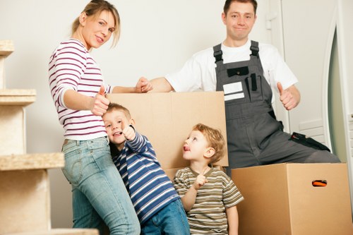 Team loading office furniture for collection in West Hampstead
